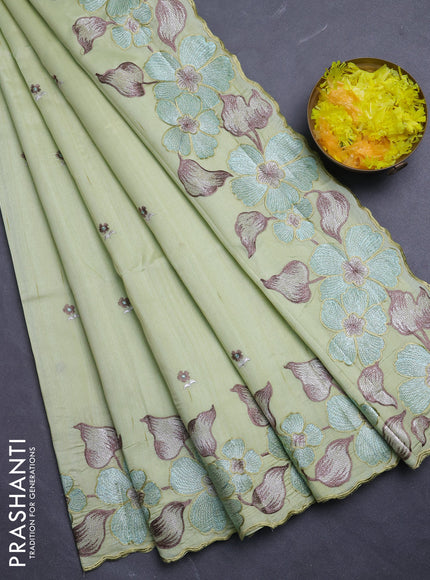 Semi raw silk saree pista green with embroidery buttas and floral embroidery border