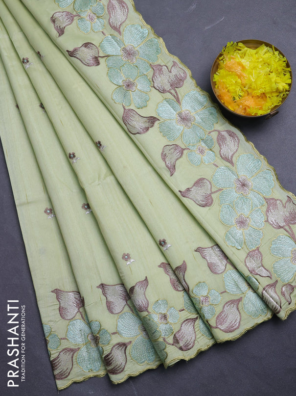 Semi raw silk saree pista green with embroidery buttas and floral embroidery border