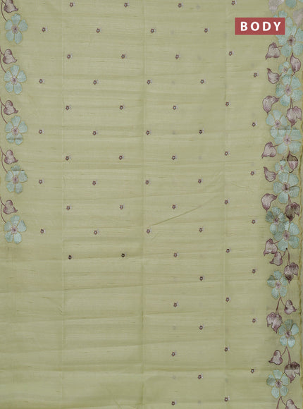 Semi raw silk saree pista green with embroidery buttas and floral embroidery border