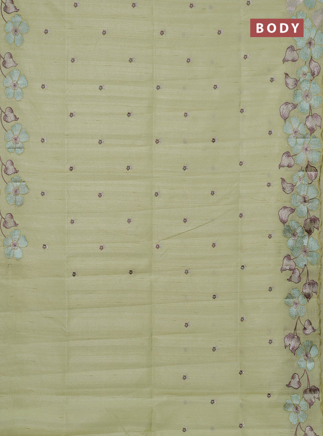 Semi raw silk saree pista green with embroidery buttas and floral embroidery border