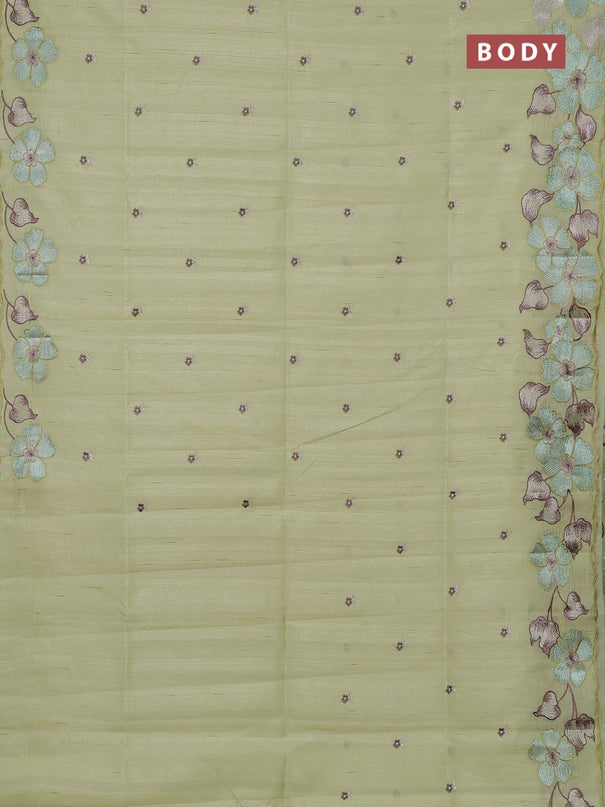 Semi raw silk saree pista green with embroidery buttas and floral embroidery border