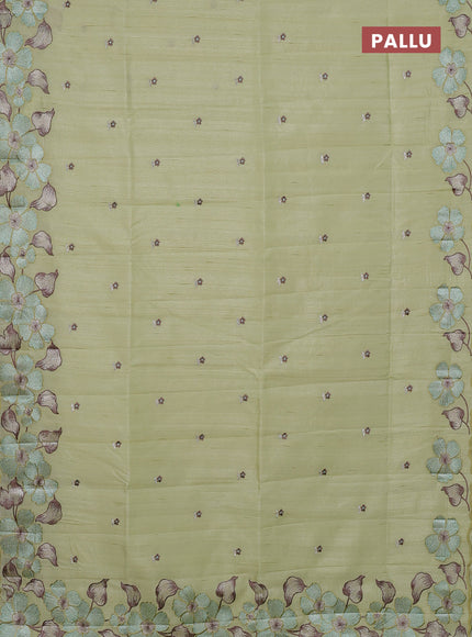 Semi raw silk saree pista green with embroidery buttas and floral embroidery border