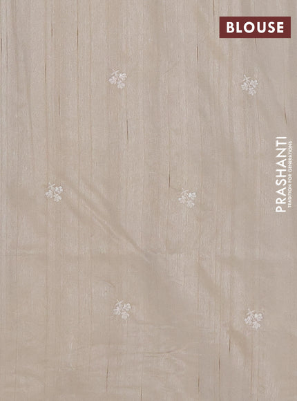 Semi raw silk saree beige with embroidery buttas and floral embroidery border