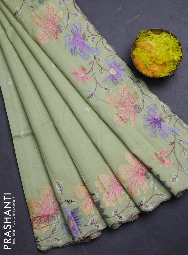 Semi raw silk saree pista green with embroidery buttas and floral embroidery border