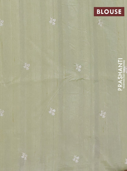 Semi raw silk saree pista green with embroidery buttas and floral embroidery border