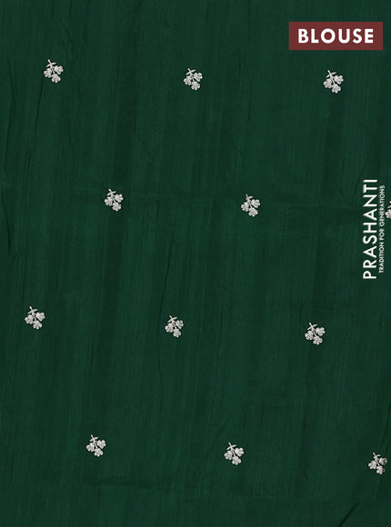 Semi raw silk saree bottle green with embroidery buttas and floral embroidery border