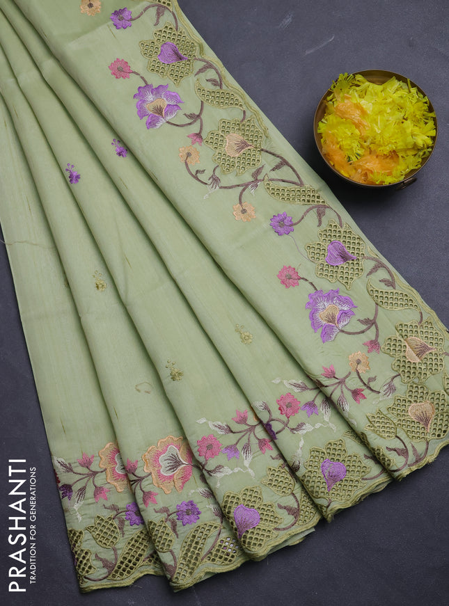 Semi raw silk saree pista green with embroidery buttas and floral embroidery border
