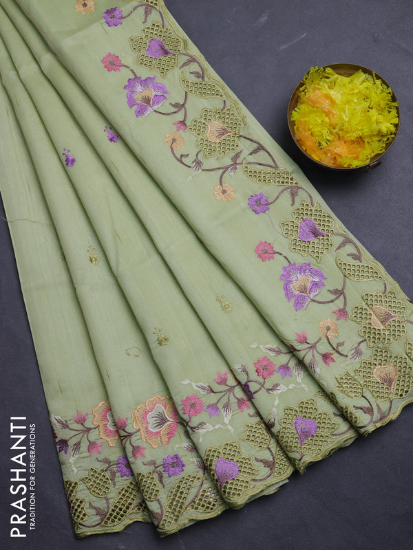 Semi raw silk saree pista green with embroidery buttas and floral embroidery border