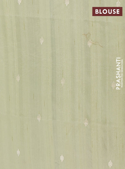 Semi raw silk saree pista green with embroidery buttas and floral embroidery border