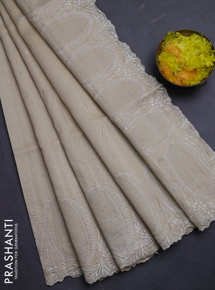 Semi raw silk saree beige with allover embroidery buttas and embroidery border