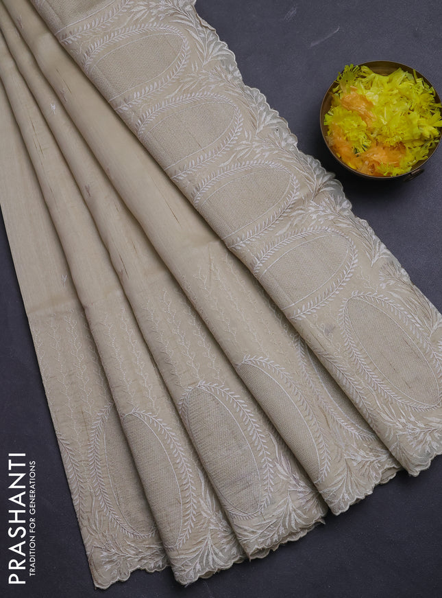 Semi raw silk saree beige with allover embroidery buttas and embroidery border