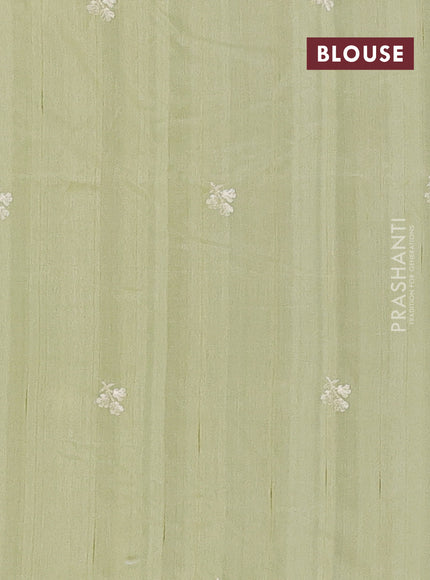 Semi raw silk saree pista green with embroidery buttas and embriodery border