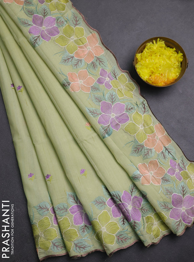Semi raw silk saree pista green with embroidery buttas and embriodery border