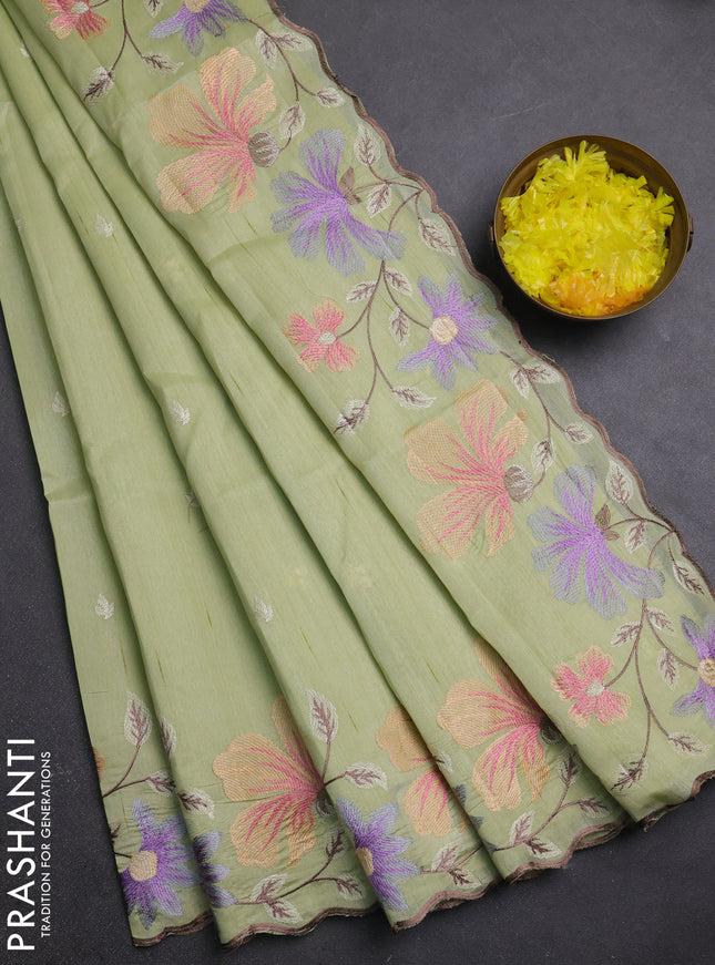 Semi raw silk saree pista green with embroidery buttas and embriodery border