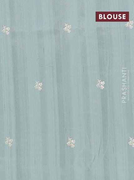 Semi raw silk saree pastel green with embroidery buttas and embriodery border
