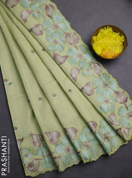 Semi raw silk saree pista green with embroidery buttas and embriodery border