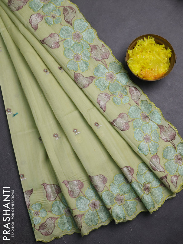 Semi raw silk saree pista green with embroidery buttas and embriodery border
