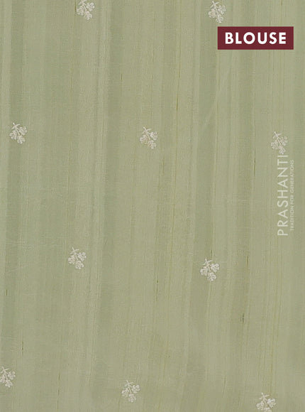 Semi raw silk saree pista green with embroidery buttas and embriodery border
