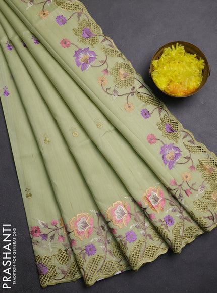 Semi raw silk saree pista green with embroidery buttas and embriodery border