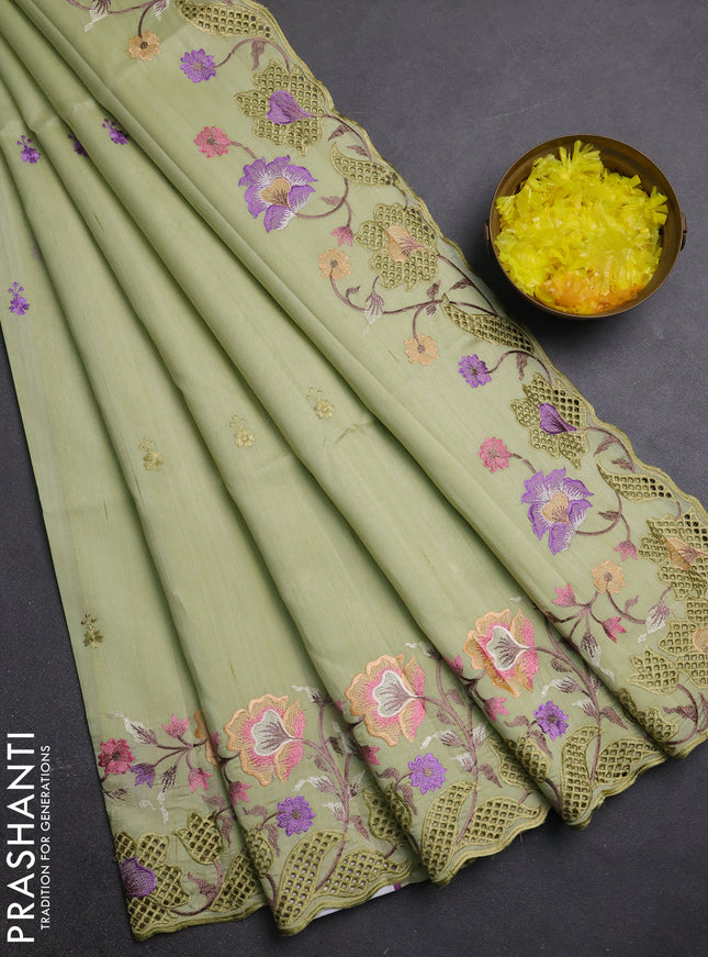 Semi raw silk saree pista green with embroidery buttas and embriodery border