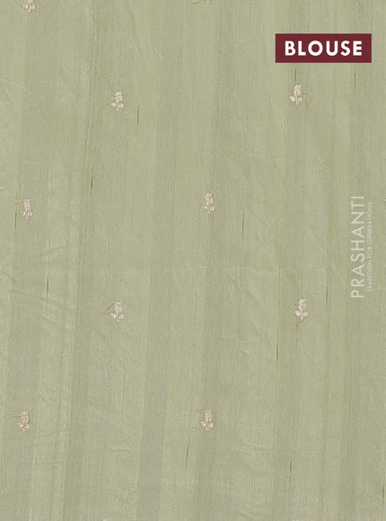 Semi raw silk saree pista green with embroidery buttas and embriodery border