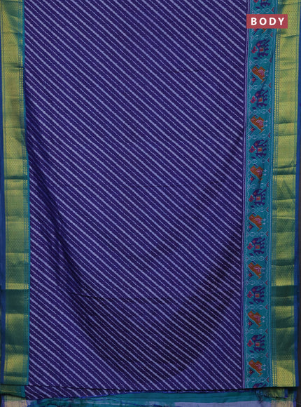 Semi tussar saree navy blue and teal green with allover patola prints and zari woven border