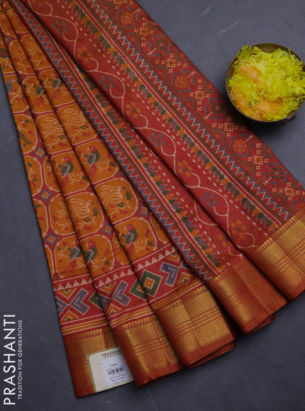 Semi tussar saree rust shade with allover patola prints and zari woven border