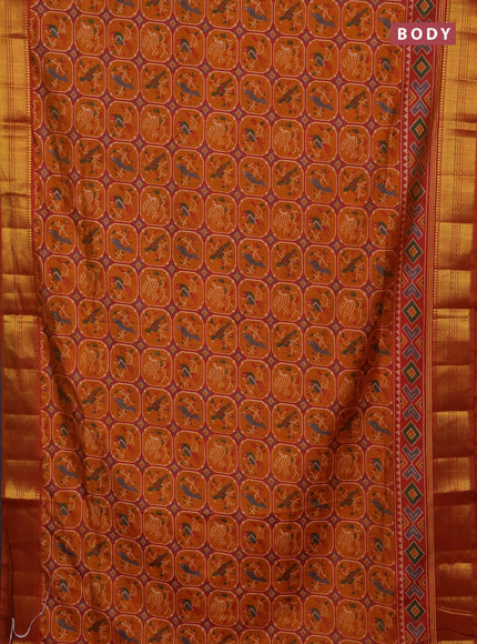 Semi tussar saree rust shade with allover patola prints and zari woven border