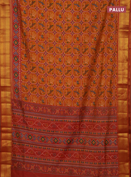 Semi tussar saree rust shade with allover patola prints and zari woven border