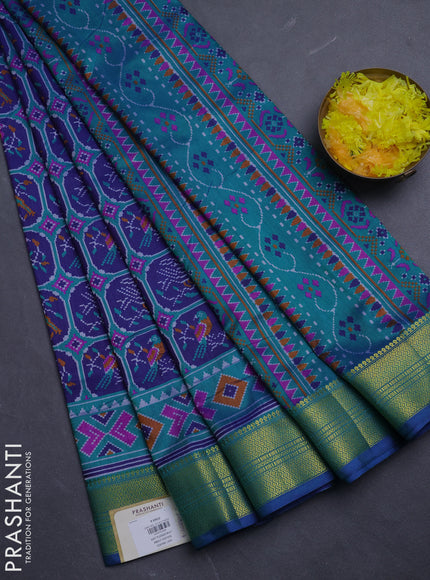 Semi tussar saree navy blue and teal green with allover patola prints and zari woven border