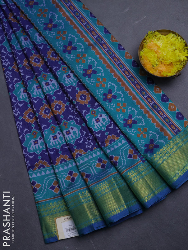 Semi tussar saree navy blue and teal green with allover patola prints and zari woven border