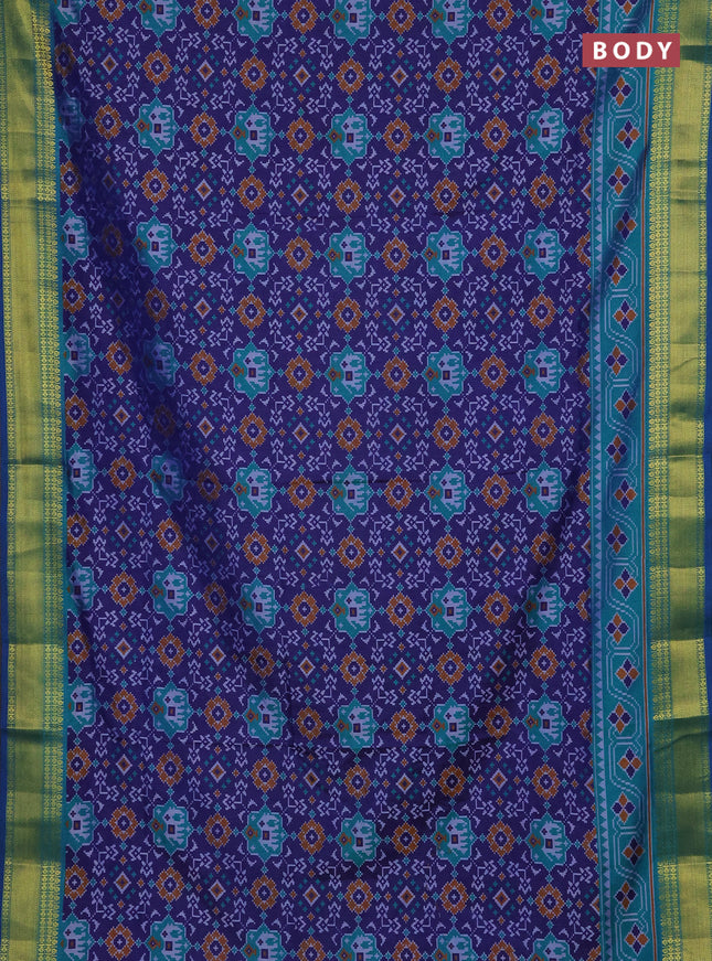 Semi tussar saree navy blue and teal green with allover patola prints and zari woven border
