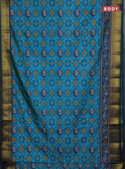 Semi tussar saree dual shade of teal green with allover patola prints and zari woven border