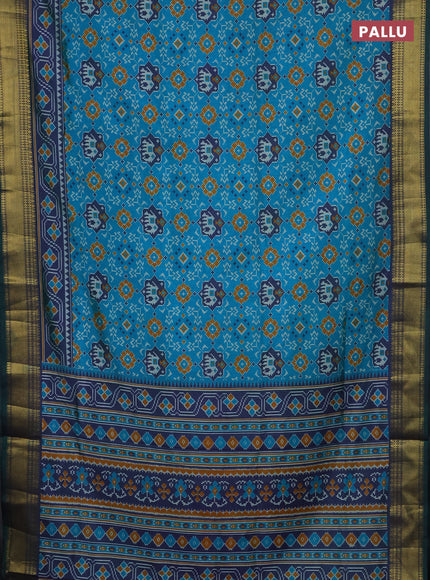Semi tussar saree dual shade of teal green with allover patola prints and zari woven border
