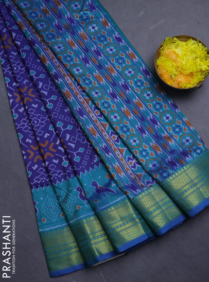Semi tussar saree navy blue and teal green with allover ikat prints and temple design zari woven border