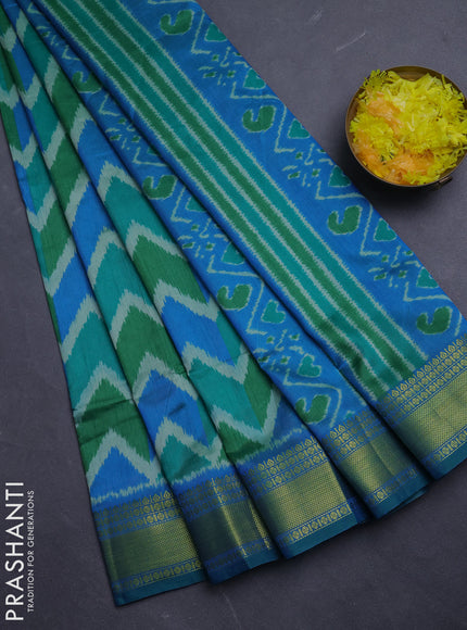 Semi tussar saree cs blue and green with allover zigzag ikat prints and zari woven border