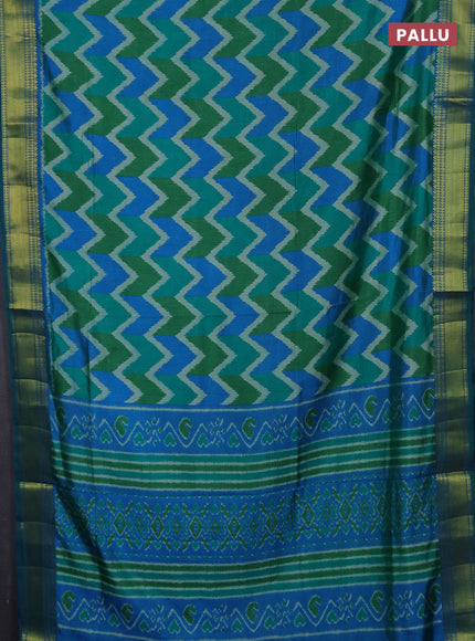 Semi tussar saree cs blue and green with allover zigzag ikat prints and zari woven border