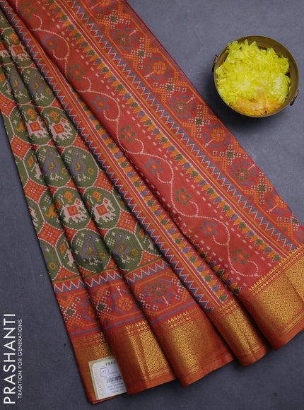 Semi tussar saree mehendi green and dark mustard with allover patola prints and zari woven border