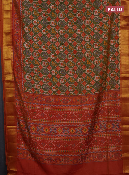 Semi tussar saree mehendi green and dark mustard with allover patola prints and zari woven border