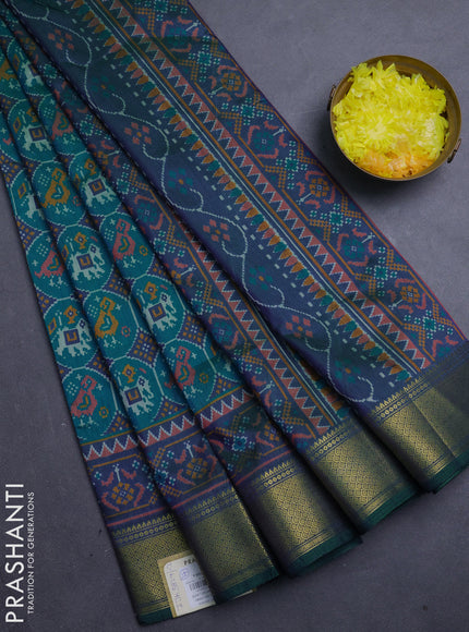 Semi tussar saree teal green and bottle green with allover patola prints and zari woven border