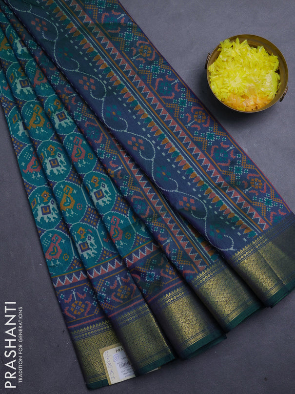 Semi tussar saree teal green and bottle green with allover patola prints and zari woven border