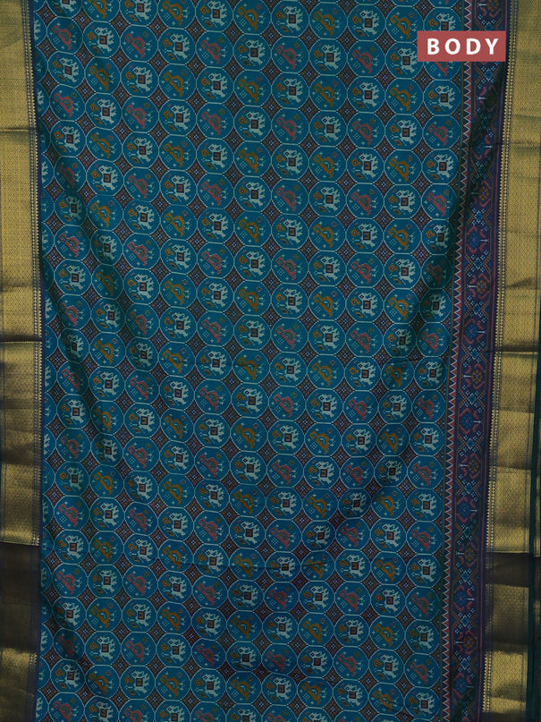 Semi tussar saree teal green and bottle green with allover patola prints and zari woven border