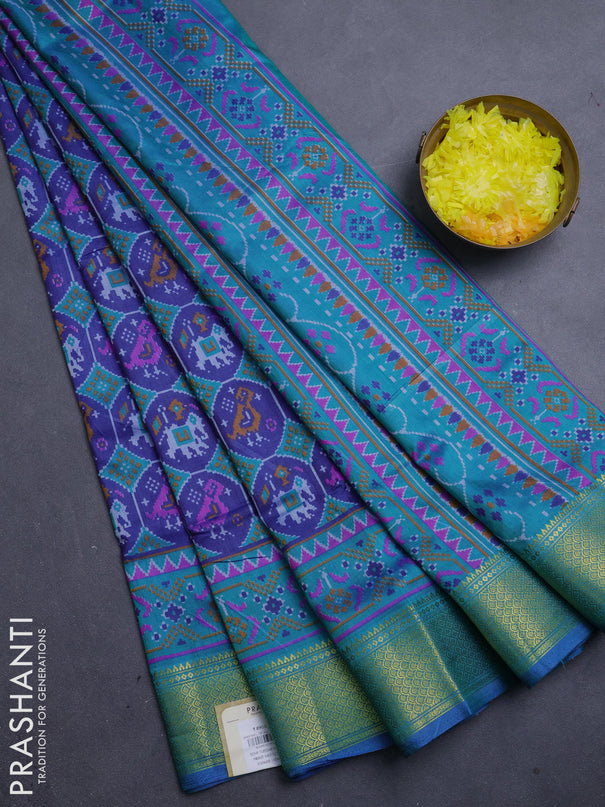 Semi tussar saree blue and teal green with allover patola prints and zari woven border
