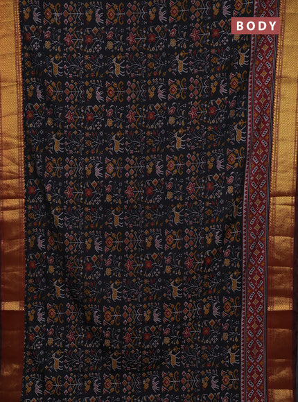 Semi tussar saree black and maroon with allover patola prints and zari woven border