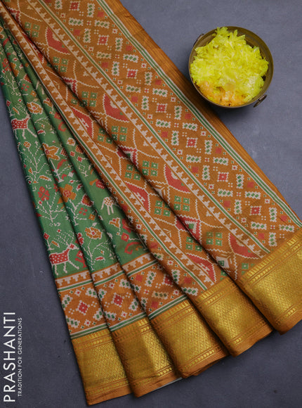 Semi tussar saree mehendi green and dark mustard with allover patola prints and zari woven border