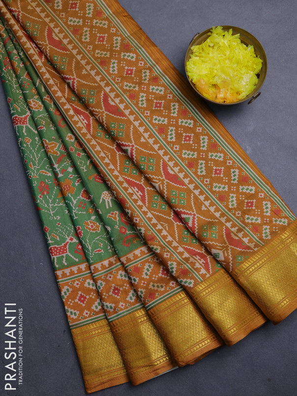 Semi tussar saree mehendi green and dark mustard with allover patola prints and zari woven border