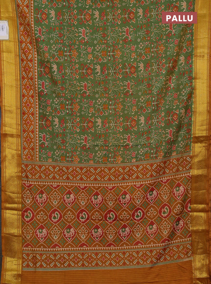 Semi tussar saree mehendi green and dark mustard with allover patola prints and zari woven border