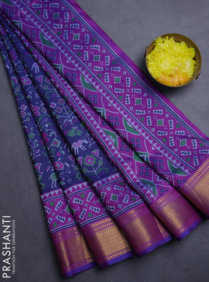Semi tussar saree navy blue and purple with allover patola prints and zari woven border