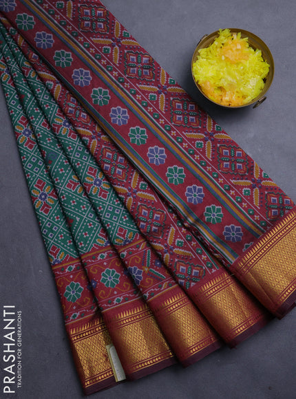 Semi tussar saree bottle green and dark maroon with allover ikat weaves and ikat zari woven border