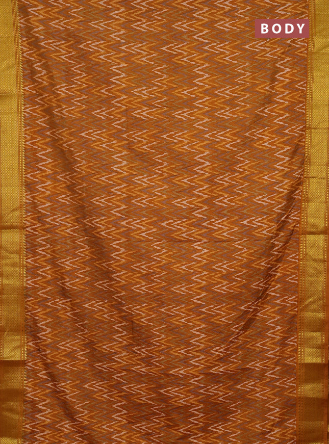 Semi tussar saree dark mustard with allover zigzag ikat prints and zari woven border